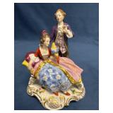 Volkstedt Figurine Depicting a Seated Woman with B