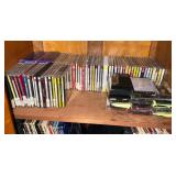 CDs and Tapes Collection on Wooden Shelf