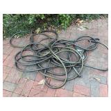 Bundle of Black Garden Hoses with Metal Fittings