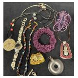 Jewelry Lot Featuring Necklaces, Bracelets, and Pe