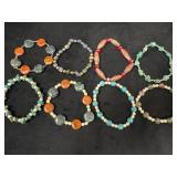 Eight Elastic Stone Bead Bracelets in Various Desi