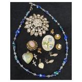 Jewelry Lot Featuring Brooches, Earrings, Necklace