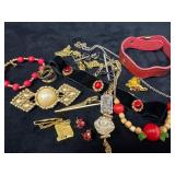 Jewelry Lot Featuring Brooches, Necklaces, and Bra