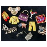 Eleven Decorative Pins in Various Designs