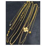 Four Gold-Tone Necklaces and One Gold-Filled Flowe