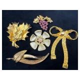 Five Gold-Tone Brooches with Varied Designs