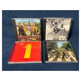 Four The Beatles Music CDs Including 