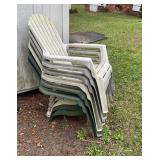 Stack of Six Plastic Outdoor Chairs in White and G