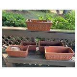 Five Terra-Cotta Planters with Decorative Leaf Mot