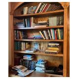 Books Arranged Across Five Wooden Shelves