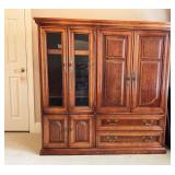 Wooden Entertainment Center with Glass Doors and D