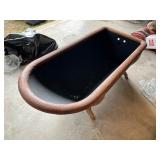 Black Cast-Iron Clawfoot Bathtub with Wooden Rim a