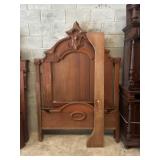 Carved Wood Bed Frame with Ornate Detailing