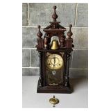 Wooden Mantel Clock With Decorative Finials and Br