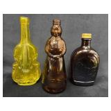 Three Decorative Glass Bottles with Unique Designs