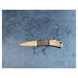 Folding Pocket Knife with Textured Handle and Sing