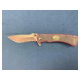 Folding Knife with Partially Serrated Blade and Te