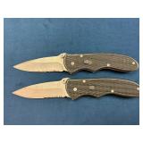 Two Folding Knives with Serrated Blades and Black