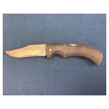 Folding Knife with Serrated Blade and Textured Han