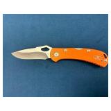 Buck Folding Pocket Knife with Orange Handle and C