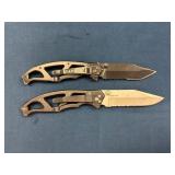 Two Gerber Folding Pocket Knives with Partially Se