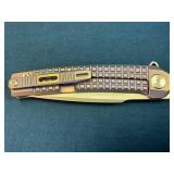 Titanium-Handled Folding Knife with Gold-Tone Blad