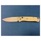 Benchmade Folding Knife with Beige Handle and Ston