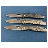 Three Gerber Folding Knives with Black Handles