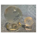 Two Glass Globe Figurines on Stands of Different S