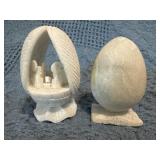 Two Carved Stone Nativity Scenes in Egg-Shaped Str