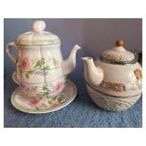 Two Stacking Teacup and Teapot Sets with Floral an
