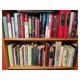 Two Shelves of Assorted Books in Various Genres