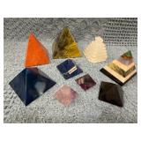 Nine Stone Pyramids Featuring Various Materials an