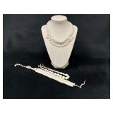 Three White Beaded Necklaces with Various Designs