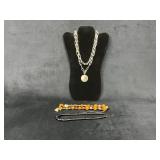 Three Necklaces Including Chains, Beaded, and Pend