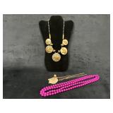 Three Costume Jewelry Necklaces Featuring Various