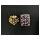 Two Brooches: Purple Enamel Floral and Yellow Gem