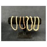 Shell and Coral Necklaces on Display Stand