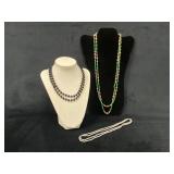 Three Beaded Necklaces: Green, Black, and White De