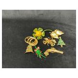 Eight Vintage Gold-Tone and Enamel Brooches in Fes