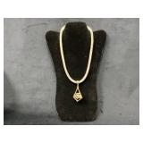 Gold-Tone Necklace with Geometric Pendant and Clea