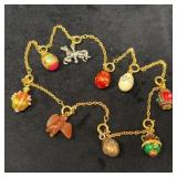 Gold Tone Charm Bracelet with 9 Charms