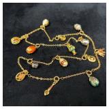 Gold Tone Chain With 14 Faberge Style Charms