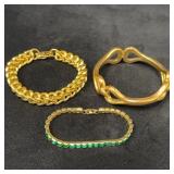 Three Gold Tone Bracelets