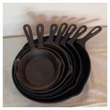 Seven Cast Iron Skillets