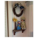 Decorative Shelf With Doll, Wreath, and Figur