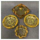Four Vintage Yellow Glass Ashtrays