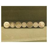 Four Voyageur CDN. Dollars /  Three 50 Cent Coins
