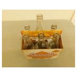 6 Pack carton of assorted coke bottles