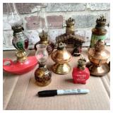 BOX LOT: 9 ASSORTED SMALL OIL LAMPS & 2 CHIMNEYS
